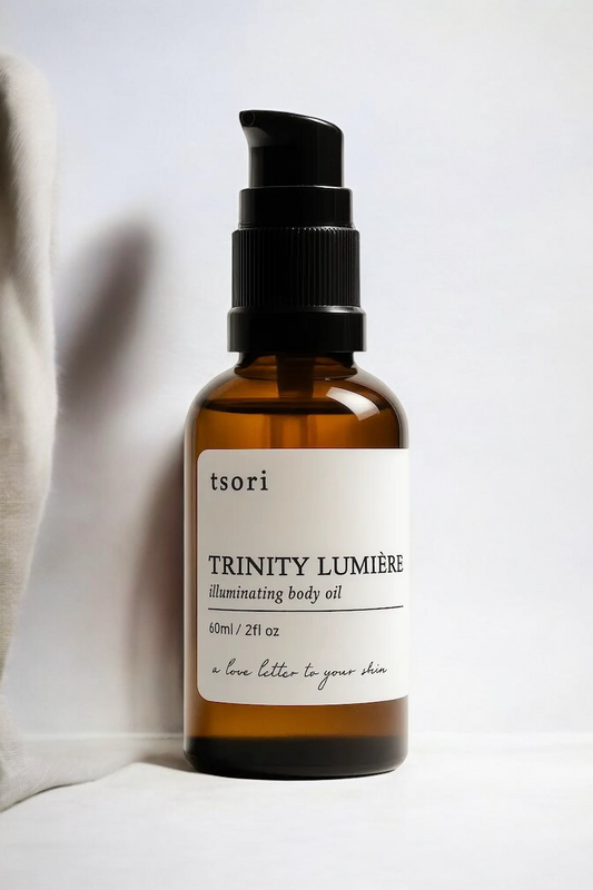 white background with trinity lumiere 3 in 1 skincare elixir