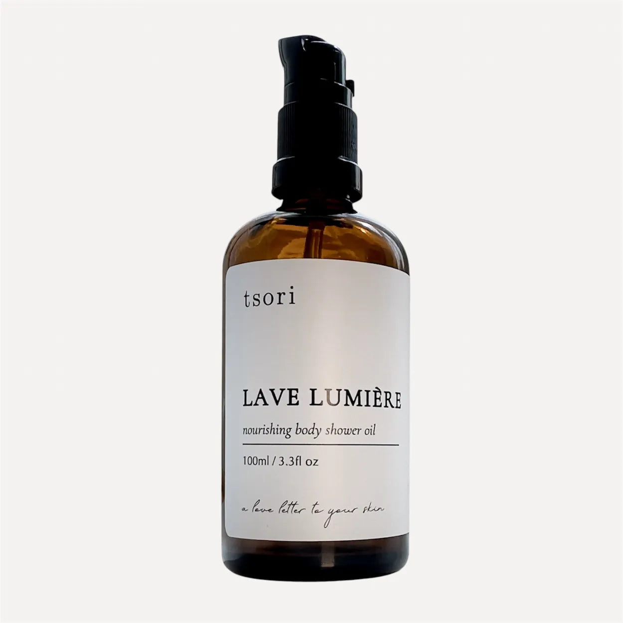 Bottle of tsori Lave Lumiere shower oil on a white background