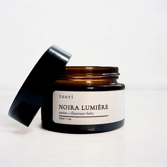 noira lumiere - anoint and illuminate balm with white background and lid off.