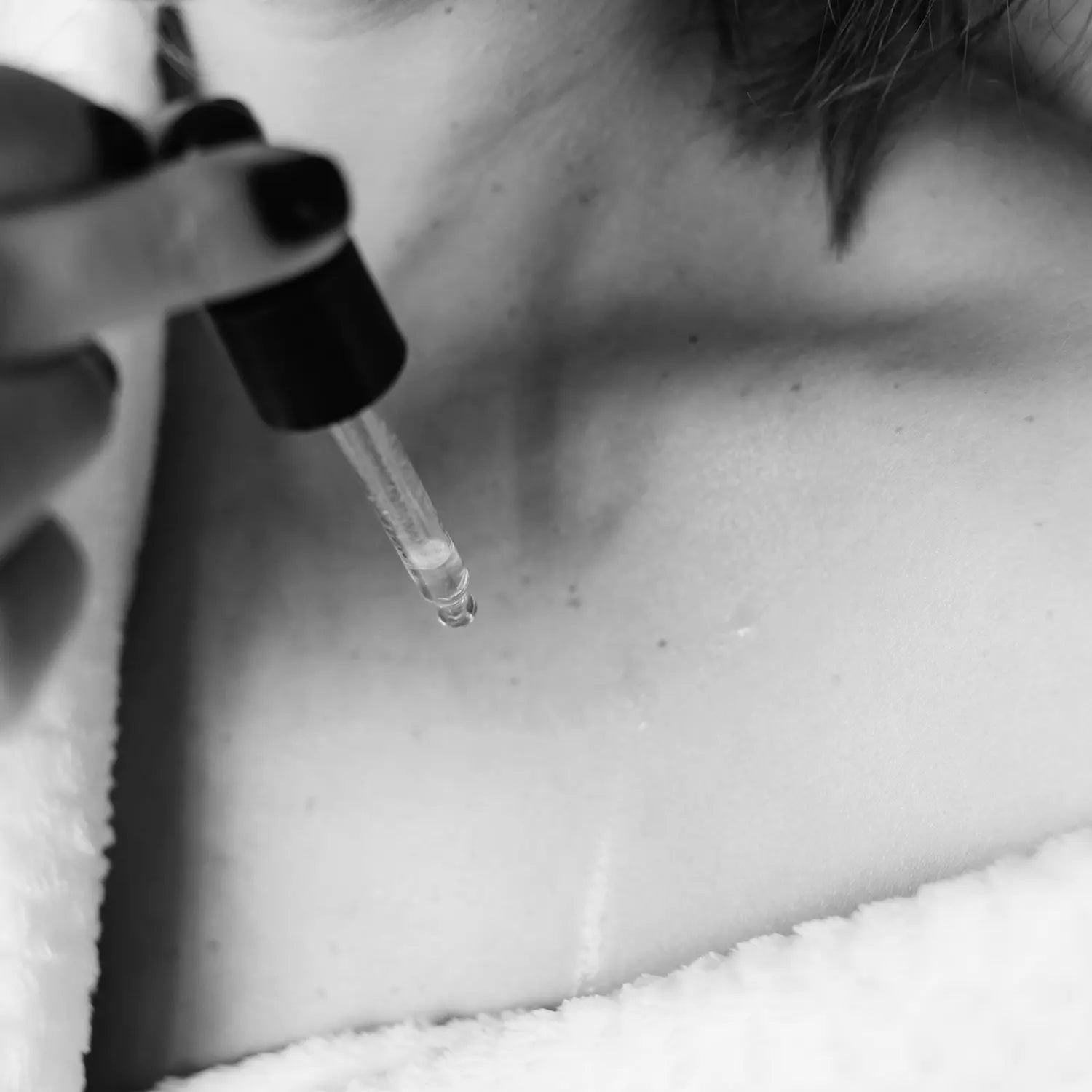 black and white image of ANOINT in dropped on chest