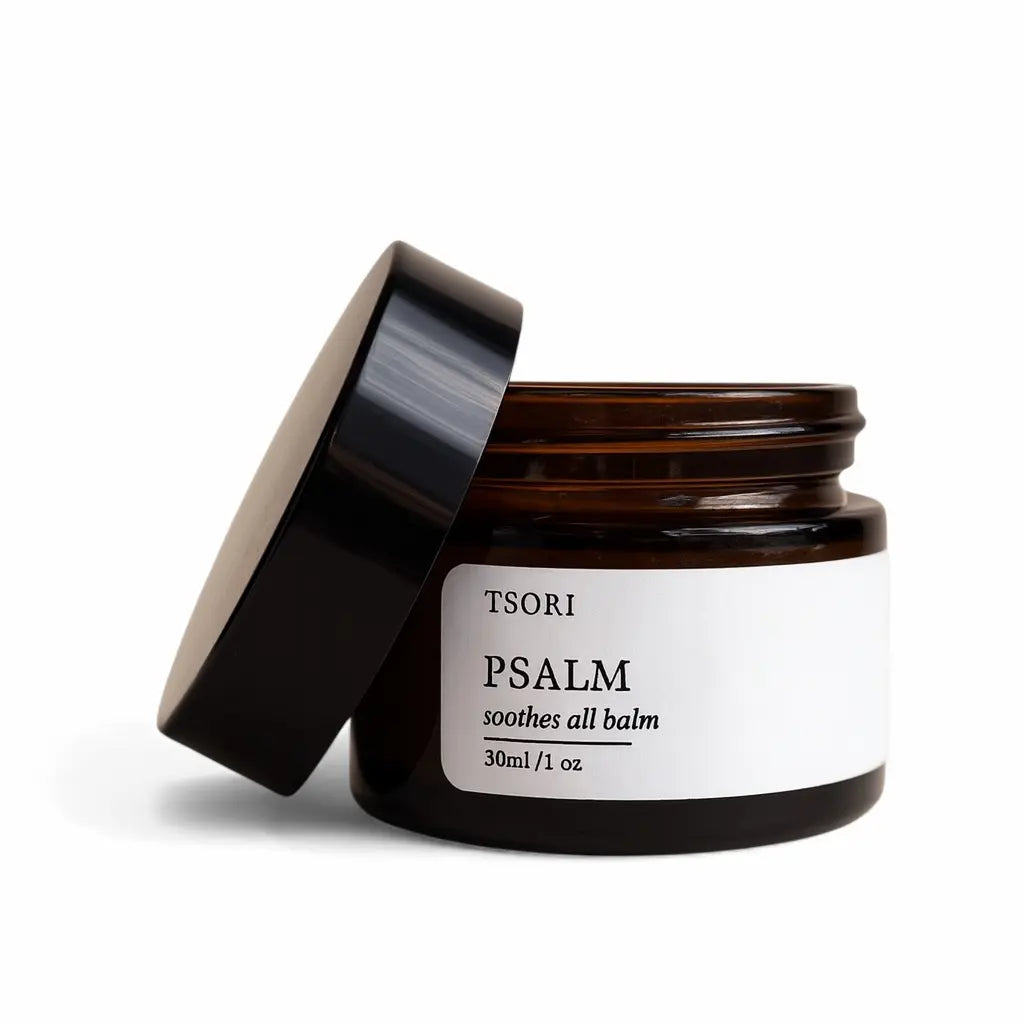 Jar of Tsori Psalm balm with a black lid on a white background